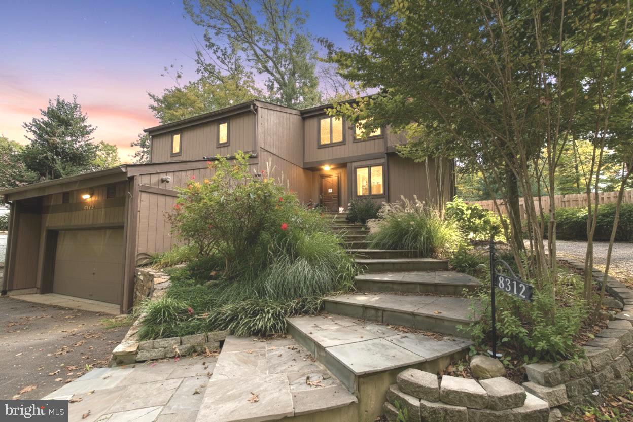 8312 Upper Spring Lane Annandale, VA 22003 - Photo 2 of 56 a front view of a house with a yard