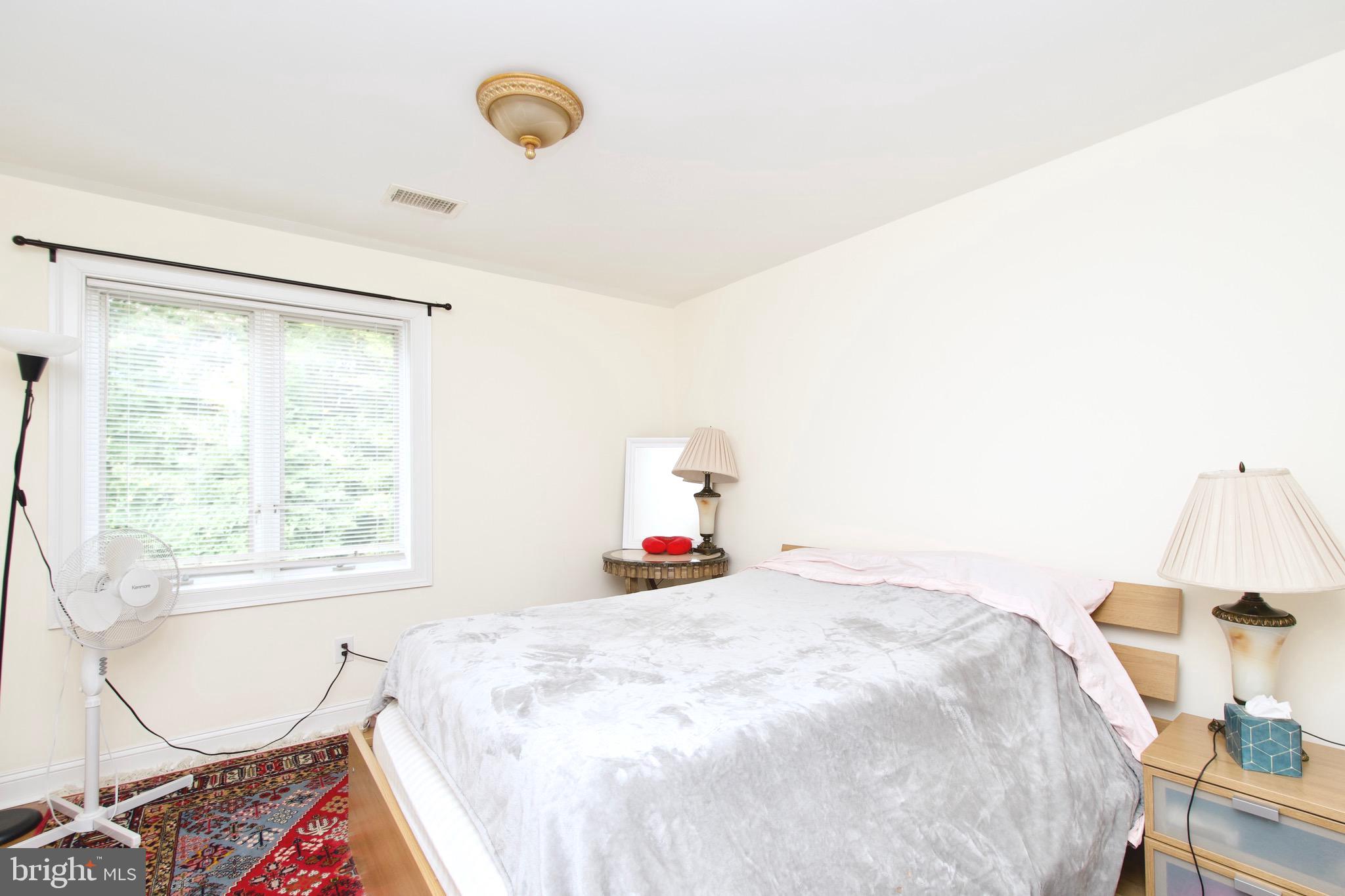 8312 Upper Spring Lane Annandale, VA 22003 - Photo 26 of 56 a bedroom with a bed and a window