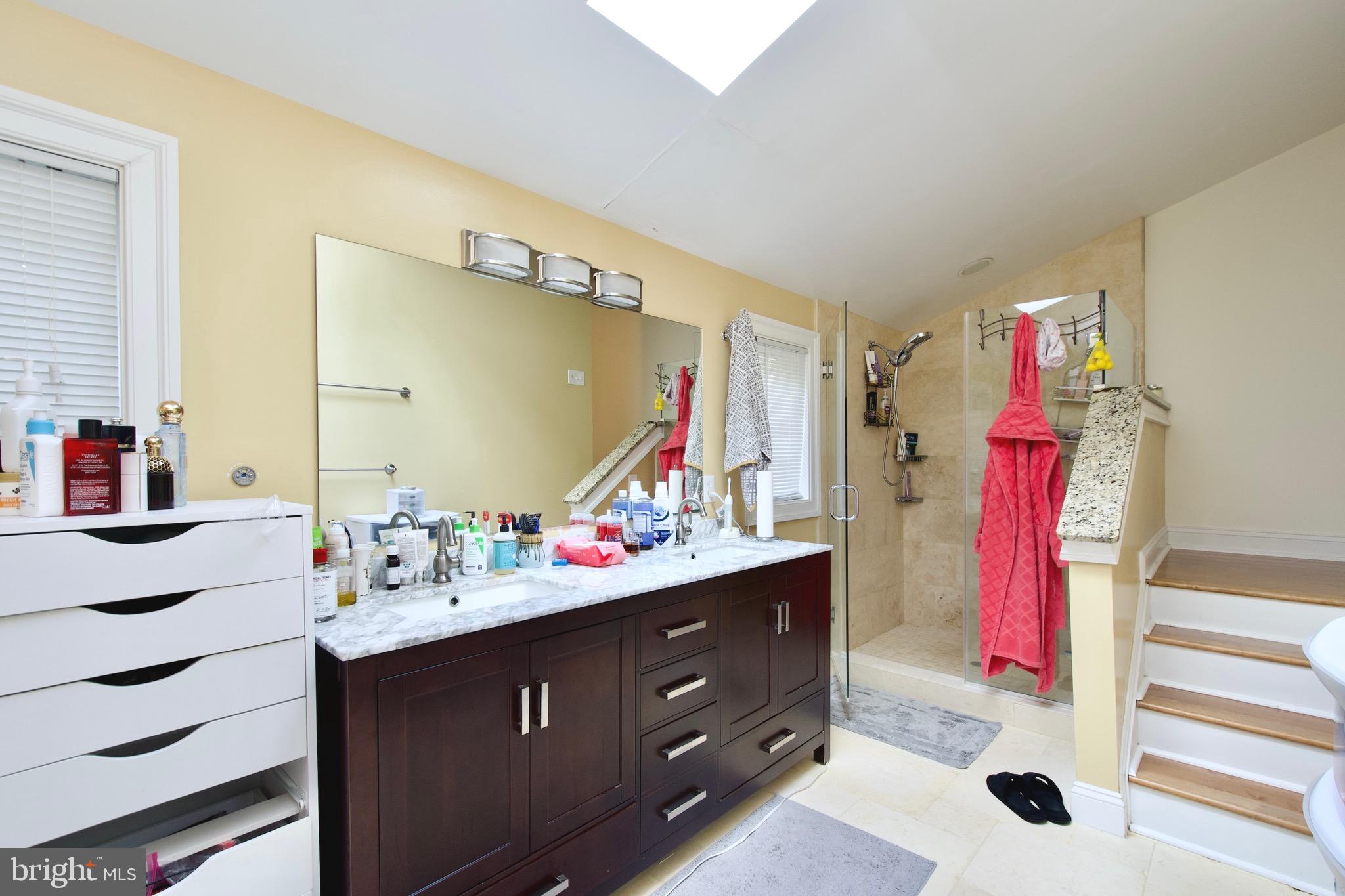 8312 Upper Spring Lane Annandale, VA 22003 - Photo 27 of 56 a bathroom with a sink vanity and a mirror
