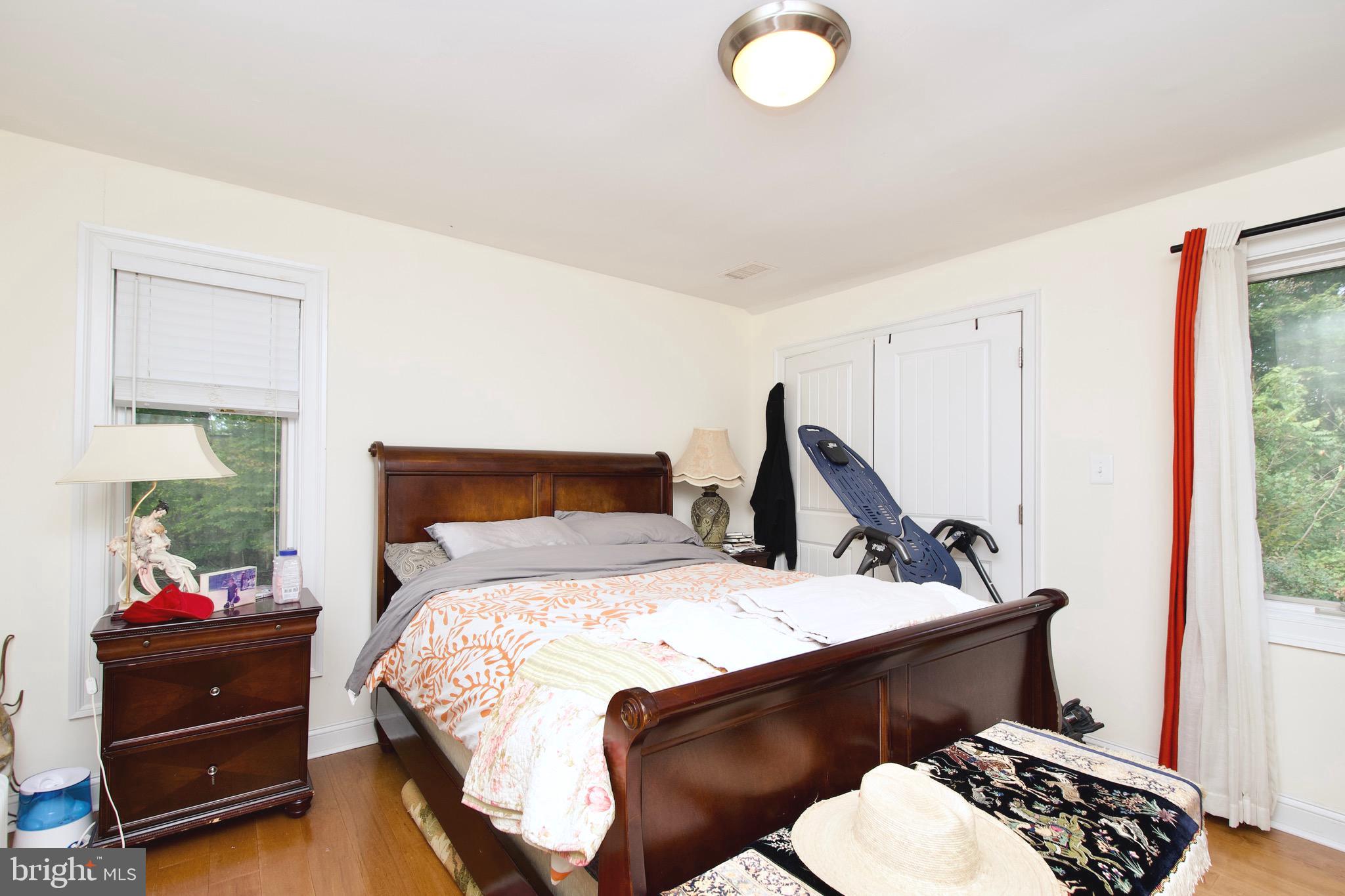 8312 Upper Spring Lane Annandale, VA 22003 - Photo 28 of 56 a bedroom with a bed and a window