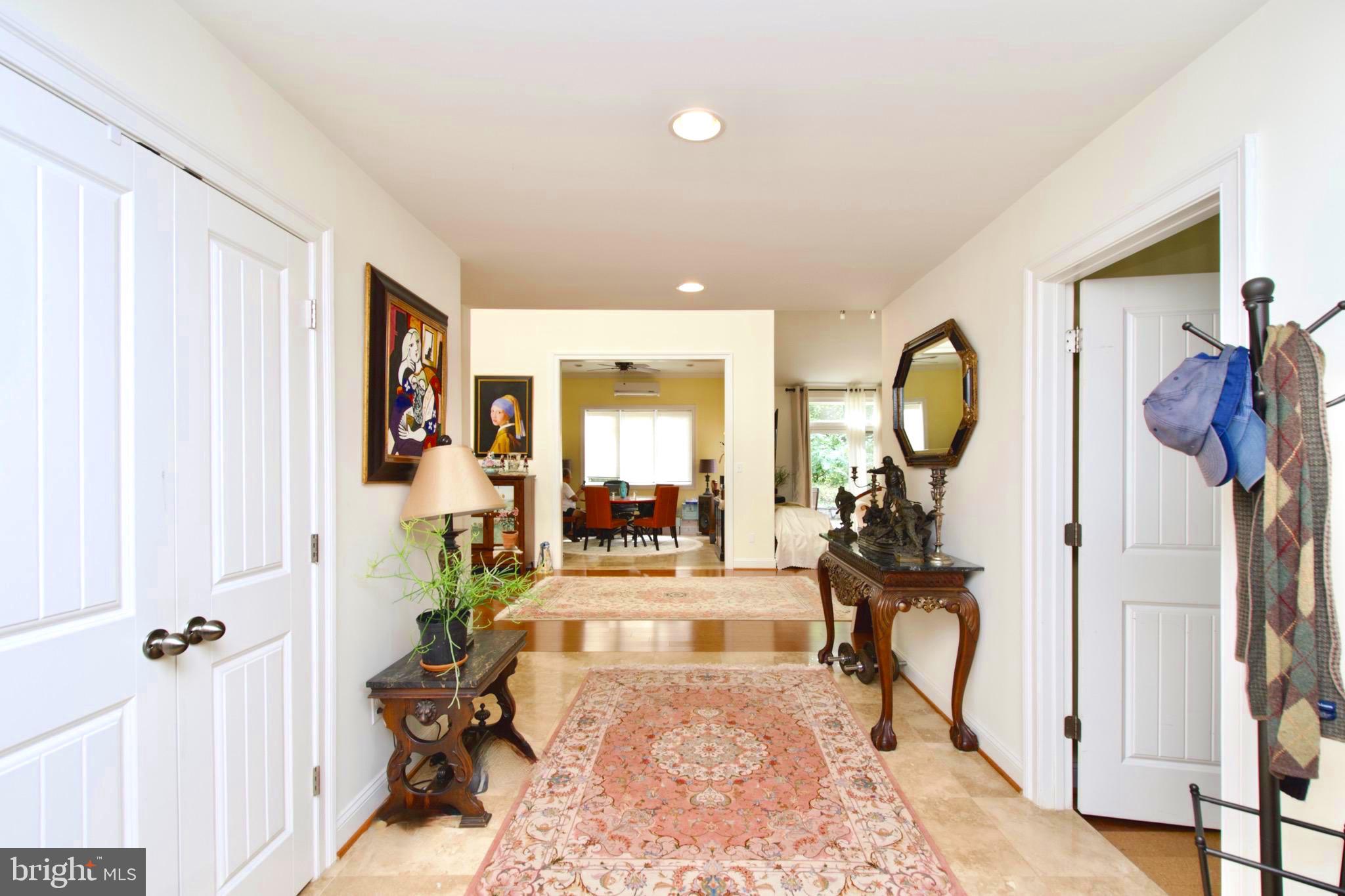 8312 Upper Spring Lane Annandale, VA 22003 - Photo 4 of 56 a living room with furniture and a mirror