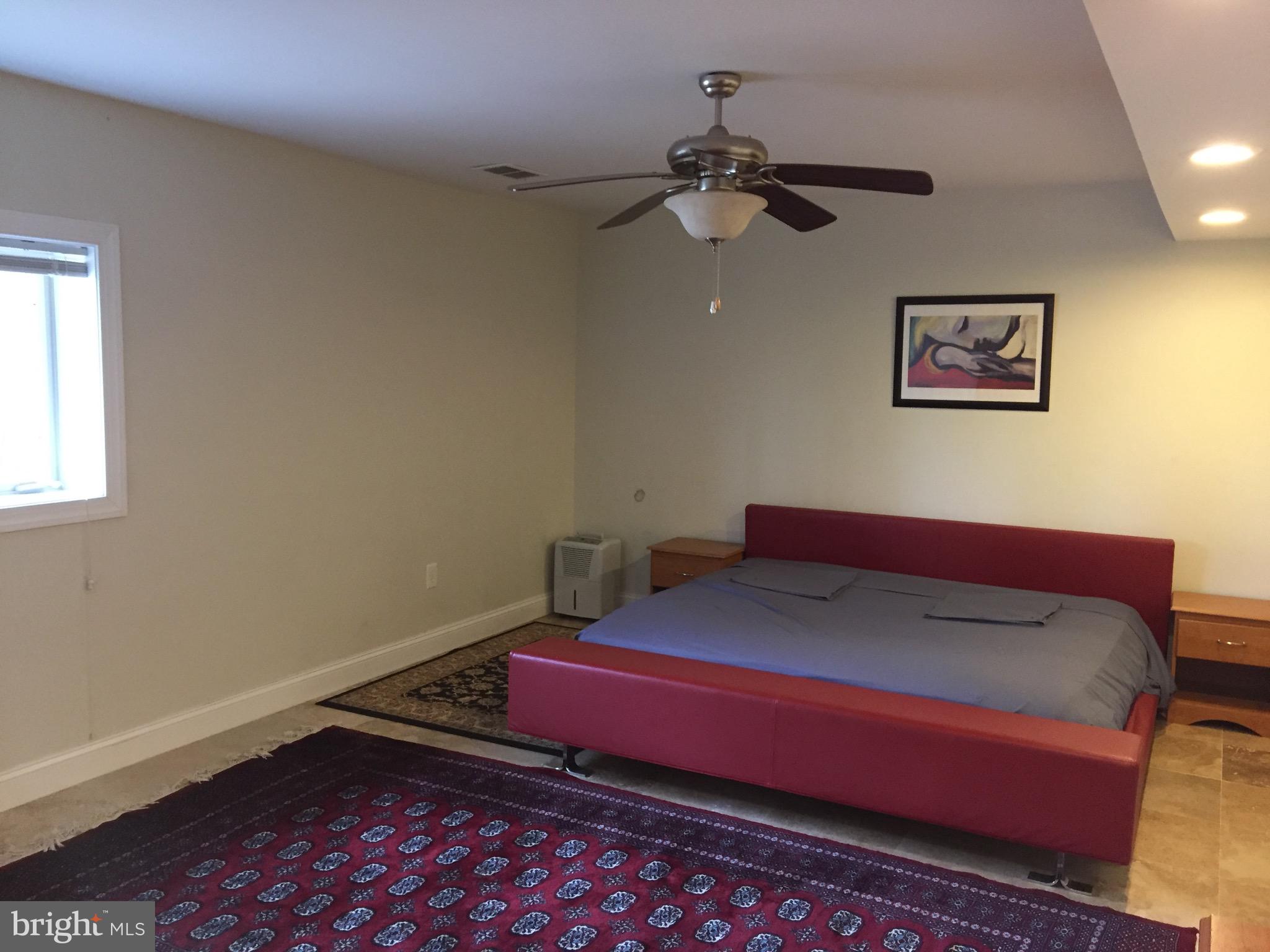 8312 Upper Spring Lane Annandale, VA 22003 - Photo 44 of 56 a bedroom with a bed and window