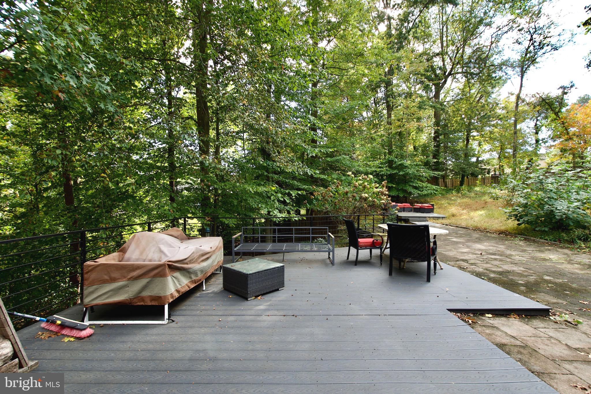 8312 Upper Spring Lane Annandale, VA 22003 - Photo 50 of 56 a backyard of a house with fire pit and outdoor seating