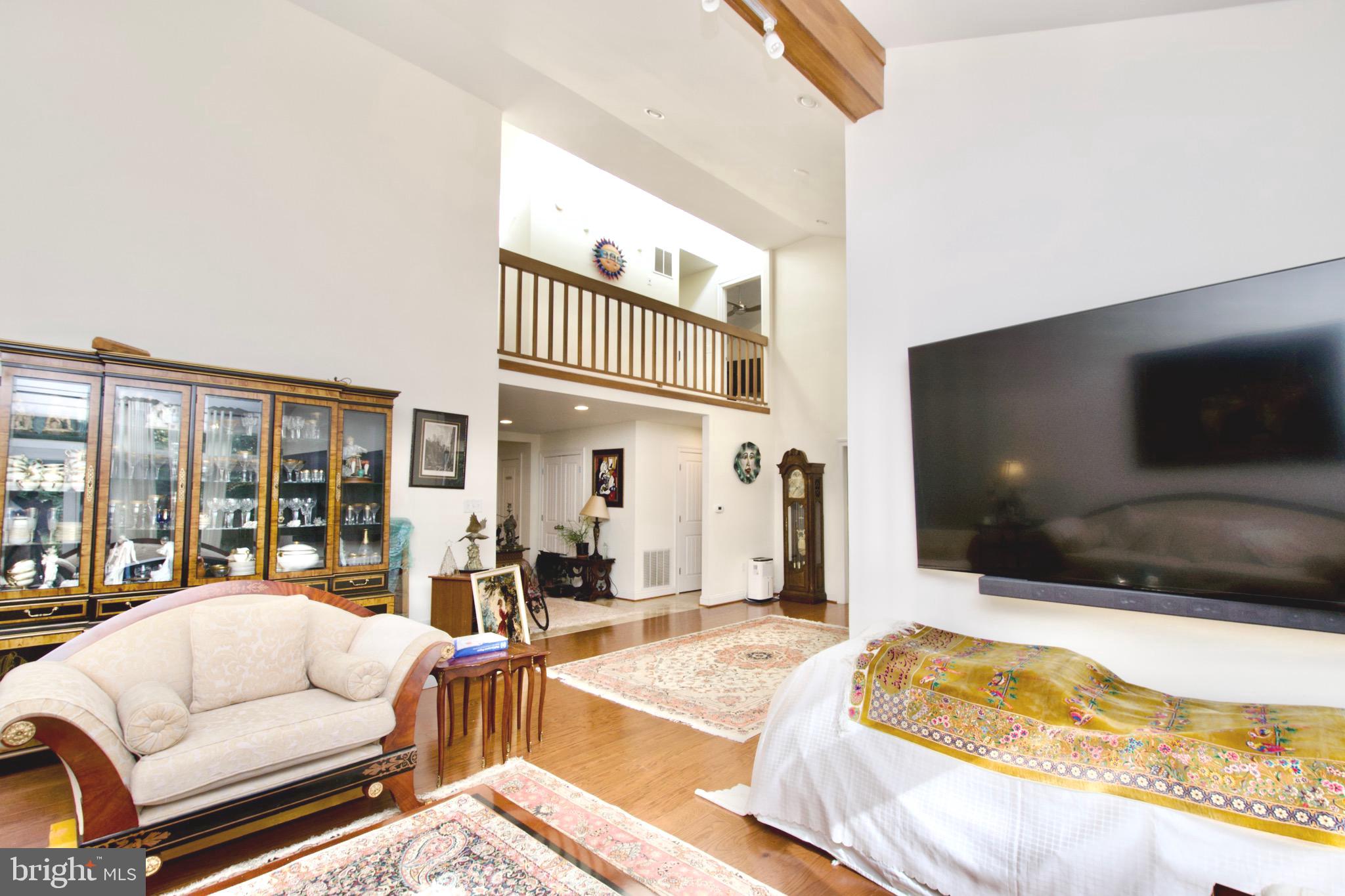 8312 Upper Spring Lane Annandale, VA 22003 - Photo 5 of 56 a living room with furniture and a flat screen tv