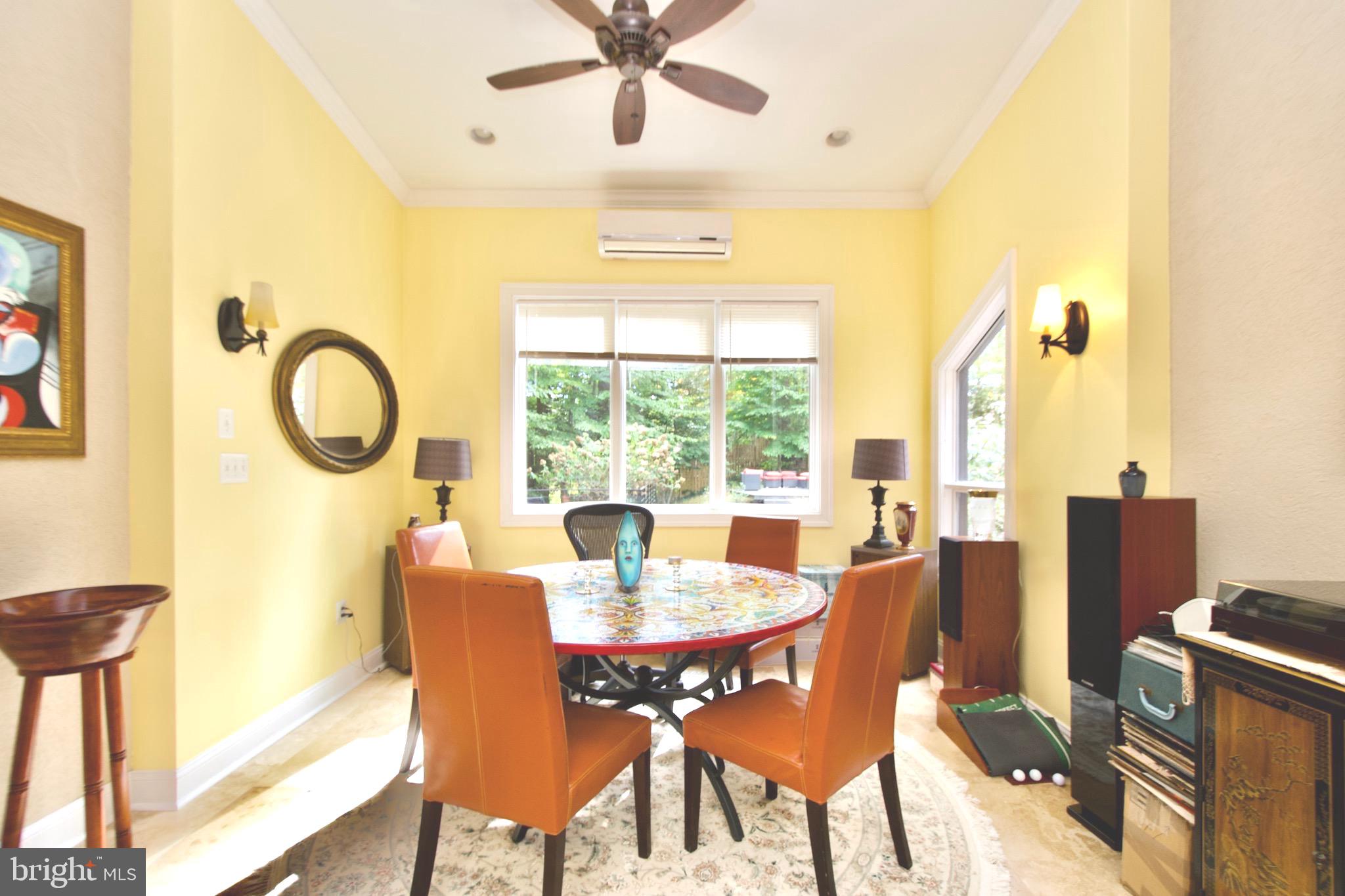 8312 Upper Spring Lane Annandale, VA 22003 - Photo 8 of 56 a dining room with furniture and a window
