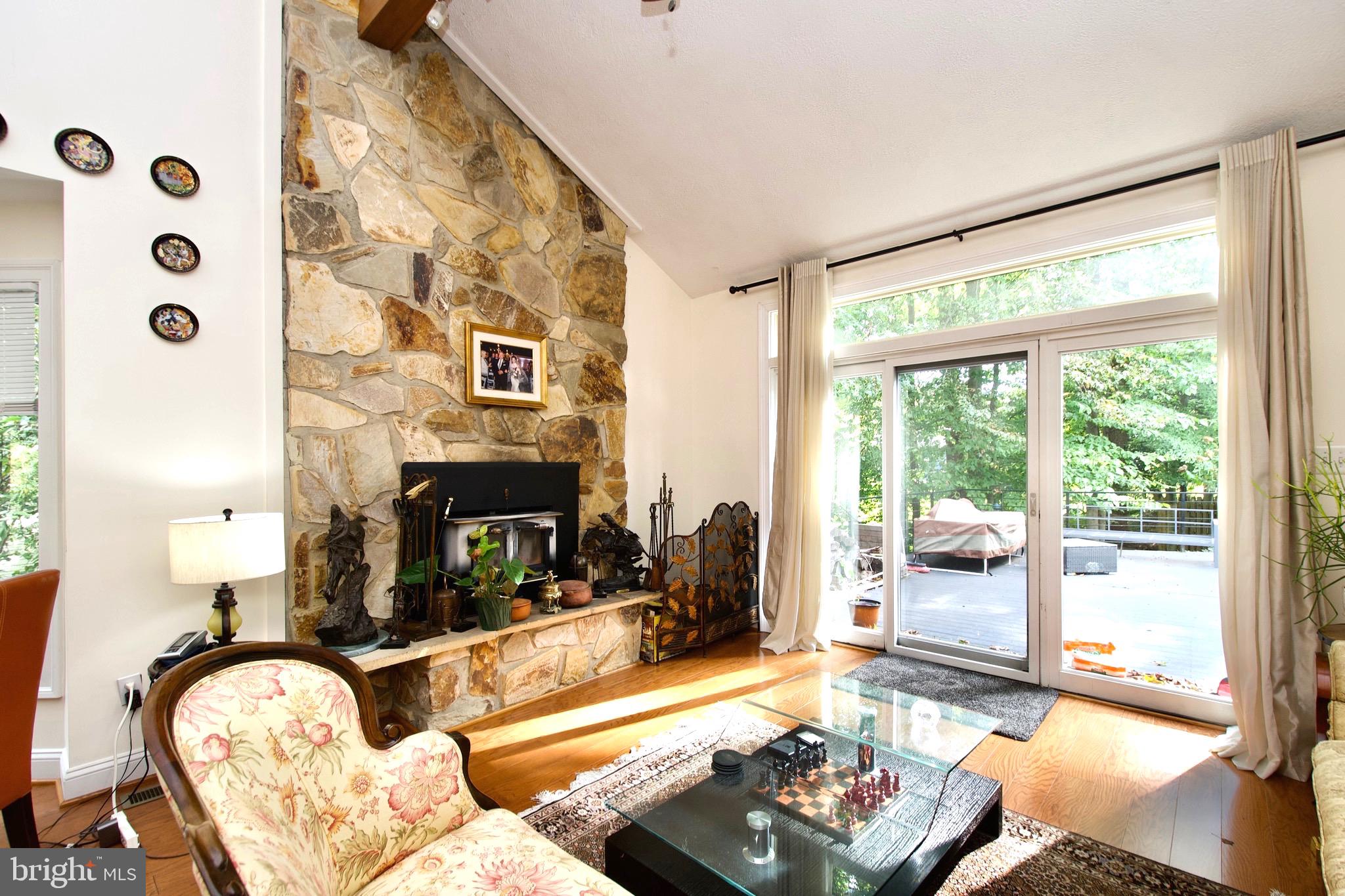8312 Upper Spring Lane Annandale, VA 22003 - Photo 10 of 56 a living room with furniture and a fireplace