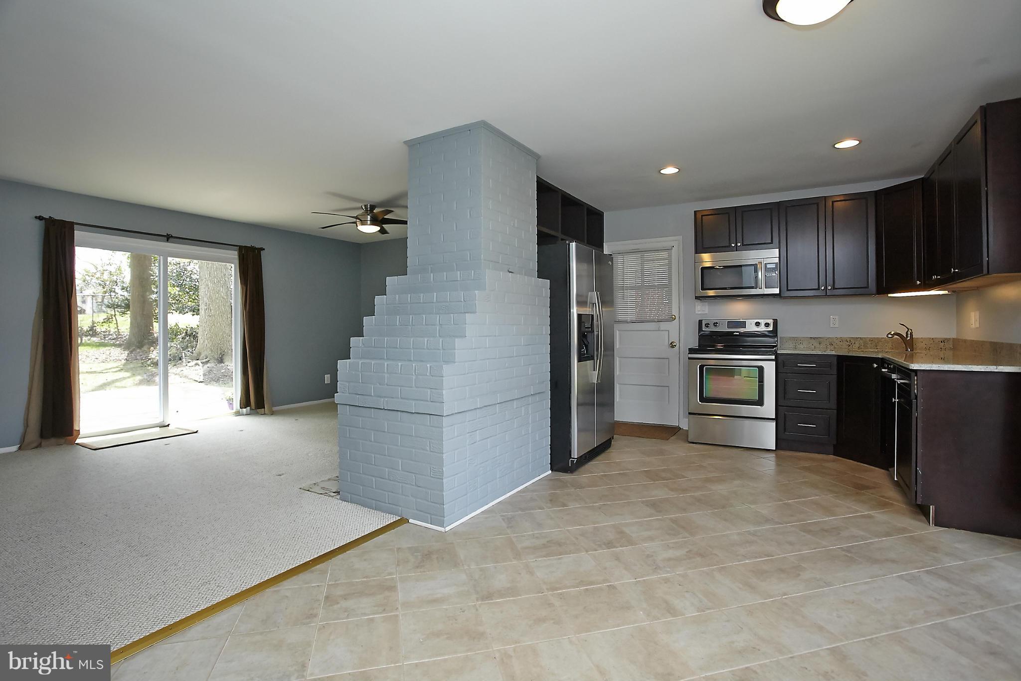 6717 Bostwick Drive Springfield, VA 22151 - Photo 3 of 12 a kitchen with refrigerator and cabinets