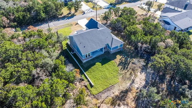 an aerial view of residential house and outdoor space