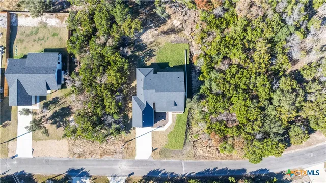 a front view of a house with a yard table and chairs