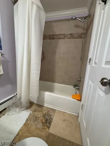 a bathroom with a tub and a shower