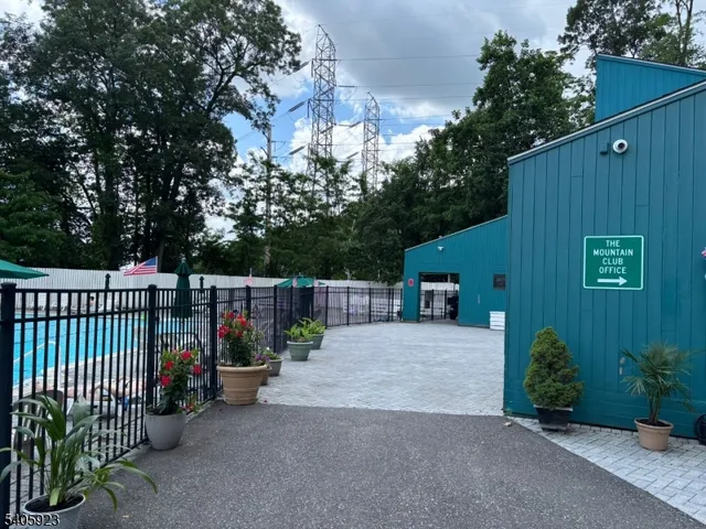 a view of a house with a small yard and plants