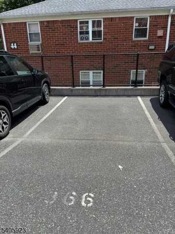 a view of street with parked cars