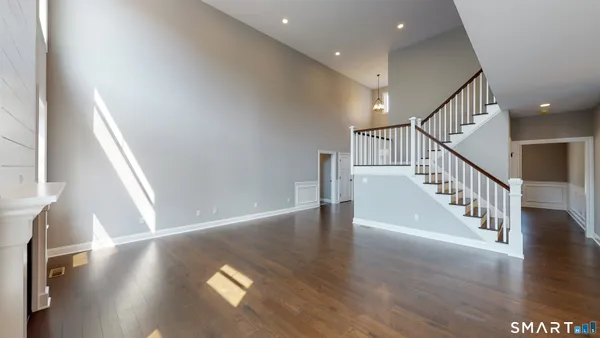 a view of an entryway with wooden floor