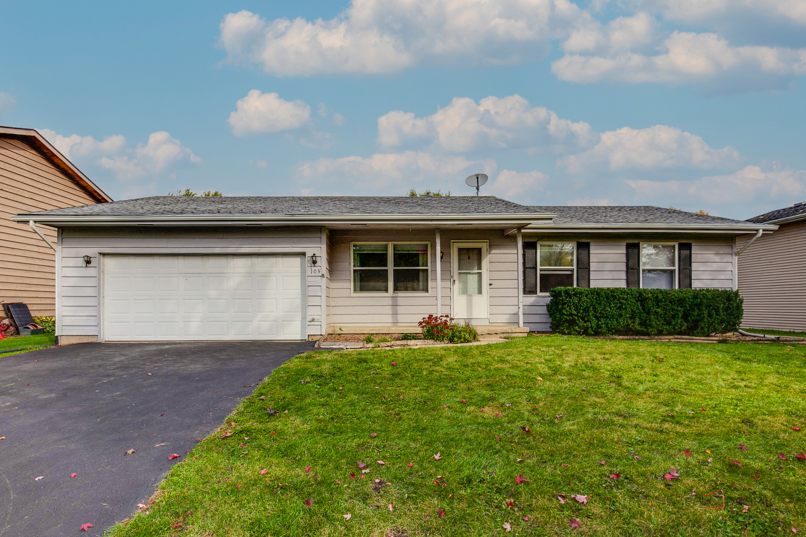 103 Quail Run Lake In The Hills, IL 60156 - Photo 1 of 25 a front view of a house with a garden and yard