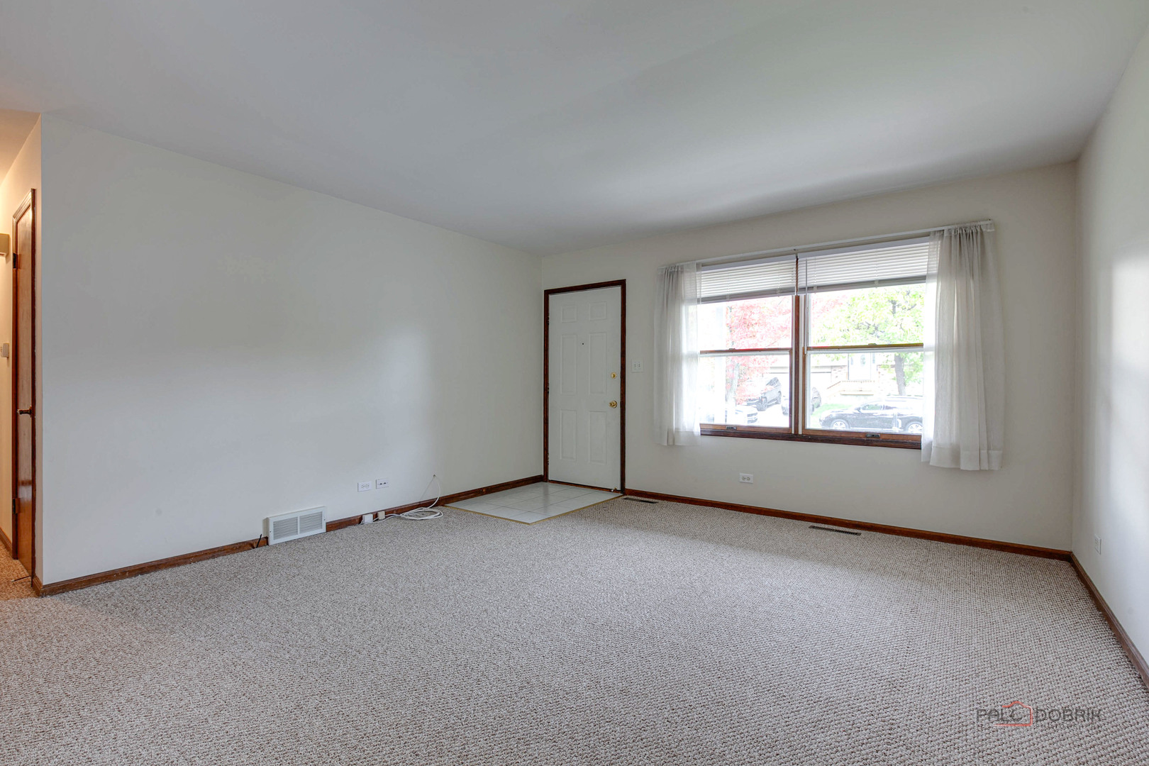 103 Quail Run Lake In The Hills, IL 60156 - Photo 4 of 25 an empty room with windows
