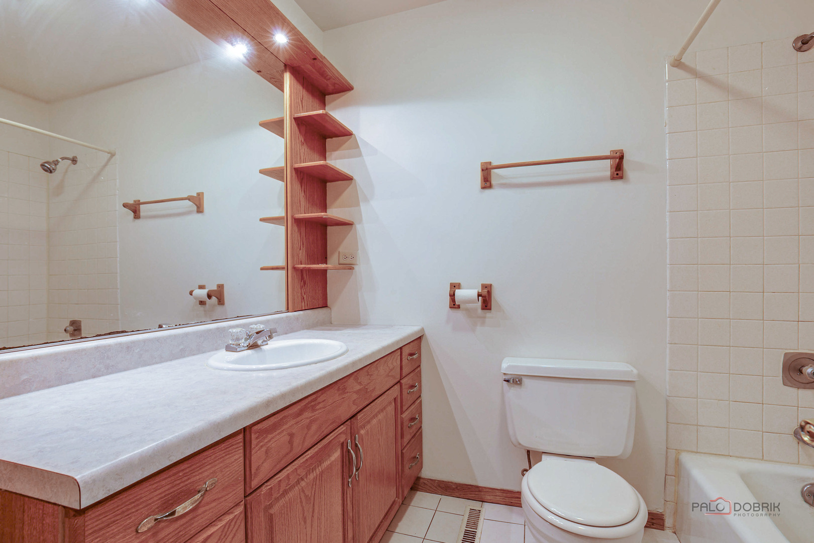 103 Quail Run Lake In The Hills, IL 60156 - Photo 9 of 25 a bathroom with a sink vanity mirror and toilet