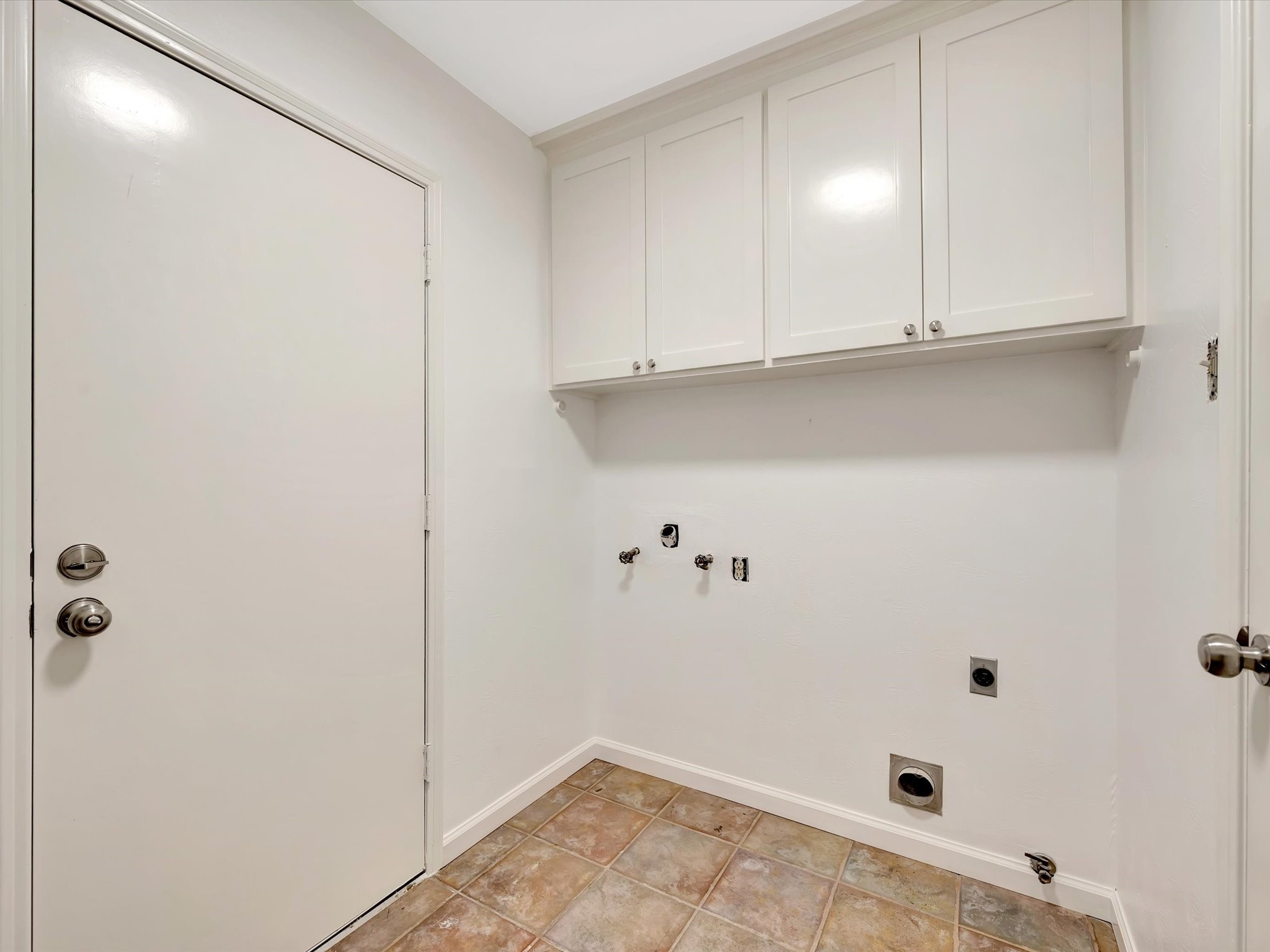 10340 Rocky Hollow Road La Porte, TX 77571 - Photo 16 of 38 Spacious laundry room featuring built-in storage cabinets and shelving.