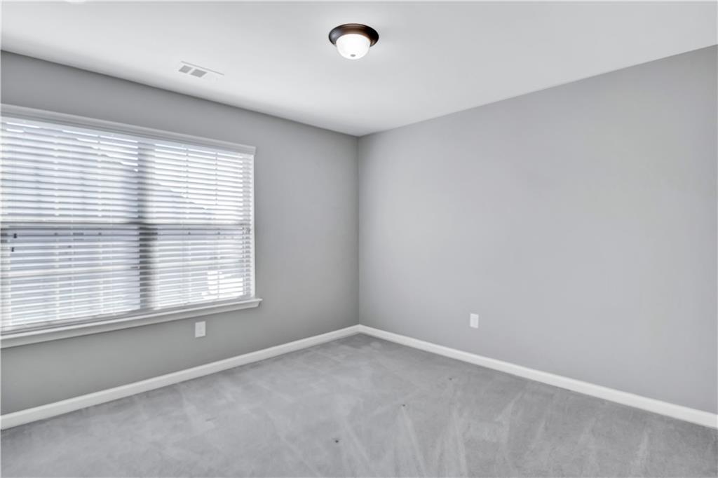 330 Avalon Square Fairburn, GA 30213 - Photo 32 of 52 an empty room with a window