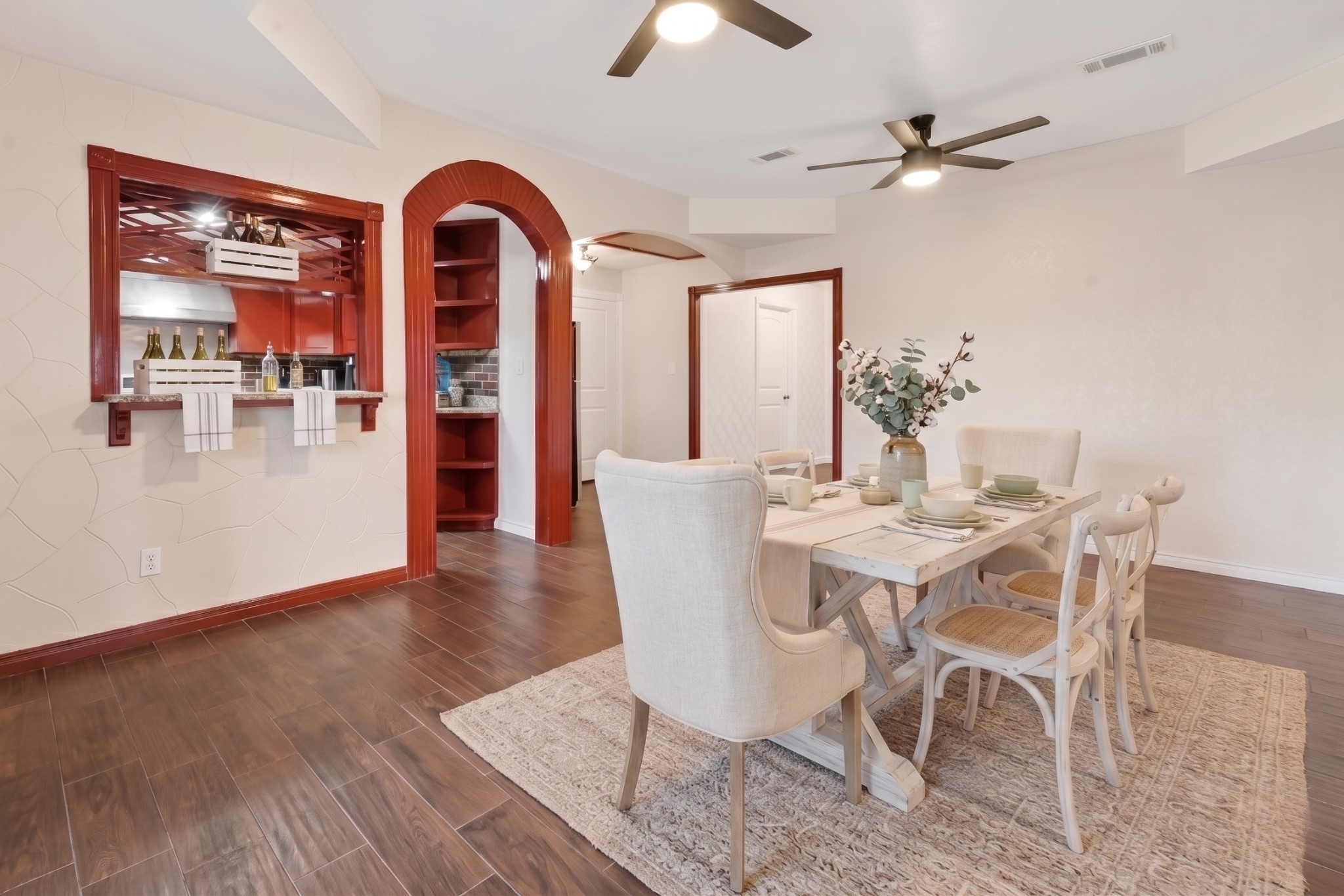 6014 Linda Drive Rosharon, TX 77583 - Photo 8 of 22 Modern ceiling fans and a generous layout provide a functional transition between the home’s primary gathering areas.**Virtually staged