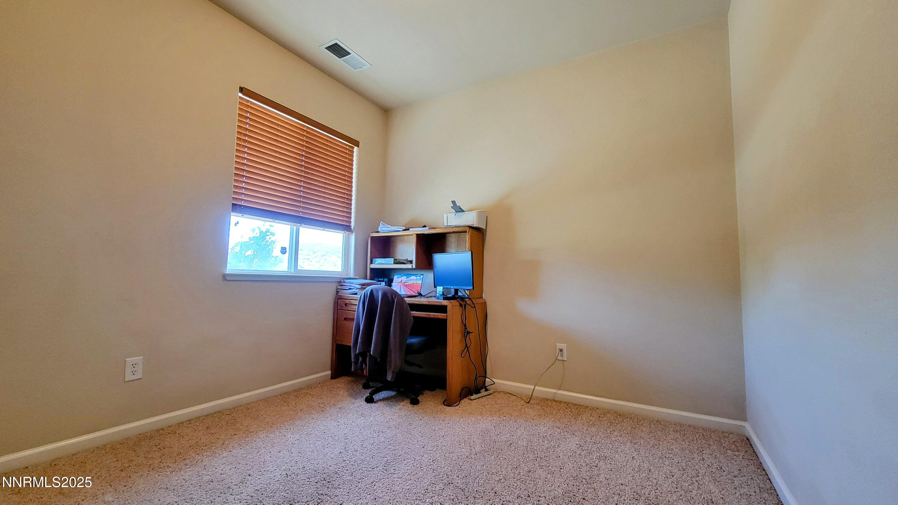 1390 Copper Leaf Drive Reno, NV 89506 - Photo 15 of 18 an empty room with windows and closet