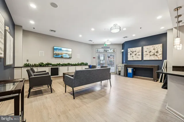 a view of a livingroom with furniture and a flat screen tv