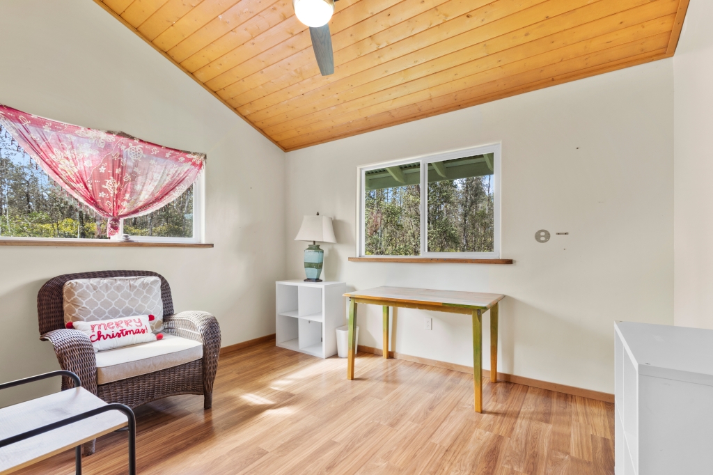 16-2103 Opeapea Road Mountain View, HI 96771 - Photo 11 of 30 a living room with furniture and a window
