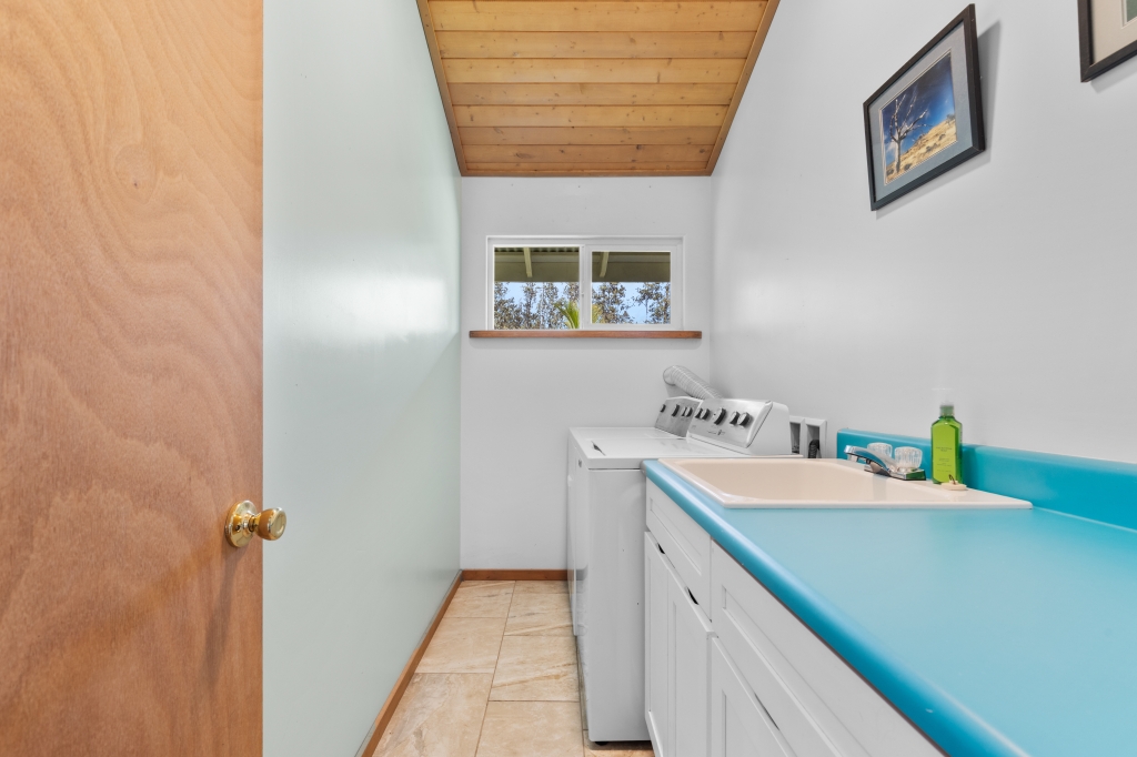 16-2103 Opeapea Road Mountain View, HI 96771 - Photo 12 of 30 a bathroom with a sink and a mirror