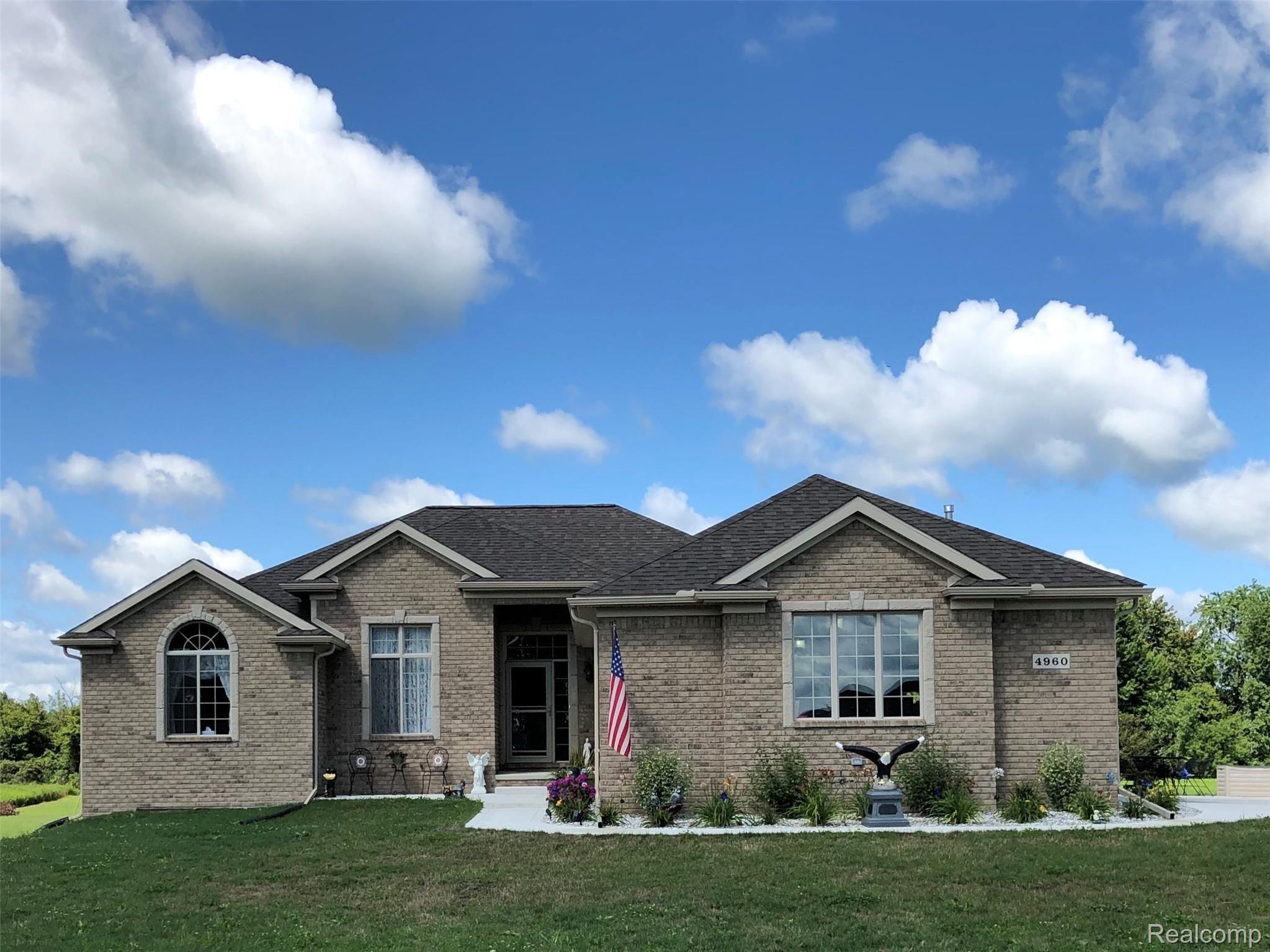 4960 Glover Road Almont, MI 48003 - Photo 1 of 35 Street view - concrete sidewalk, 50' x 30' concrete approach and limestone driveway to paved road