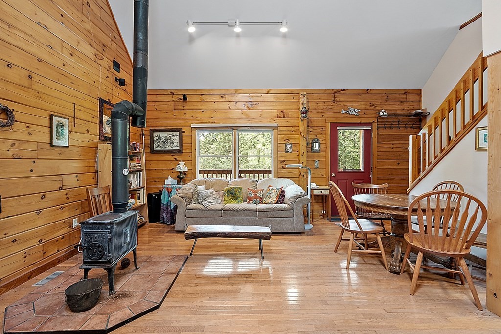 136 Wendell Road Warwick, MA 01378 - Photo 12 of 31 a living room with furniture a rug and a large window