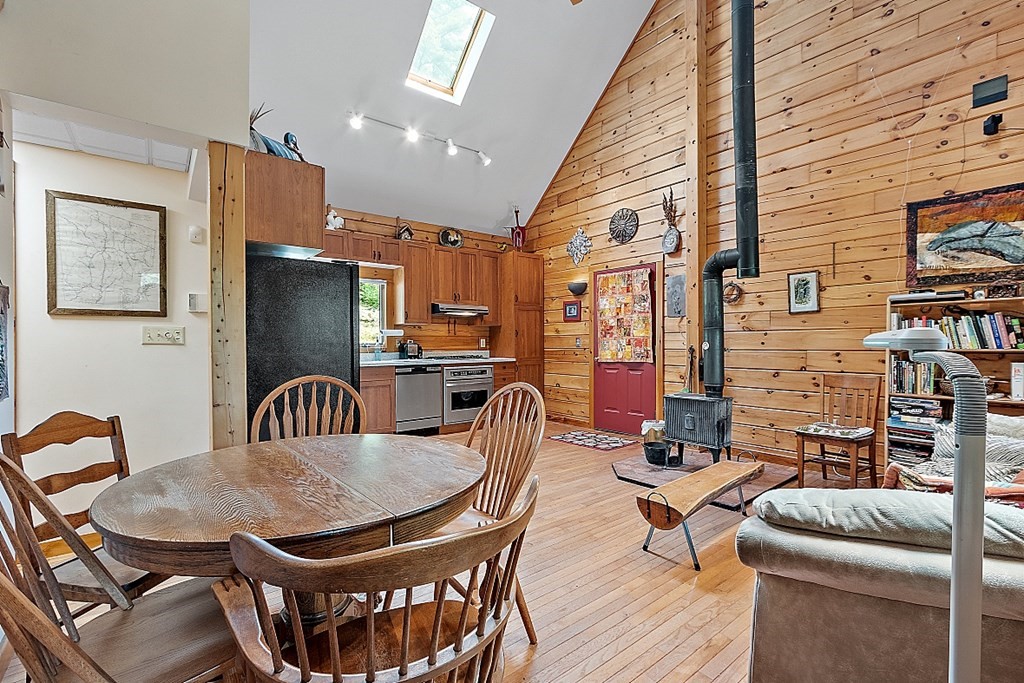 136 Wendell Road Warwick, MA 01378 - Photo 13 of 31 a dining room with furniture and wooden floor