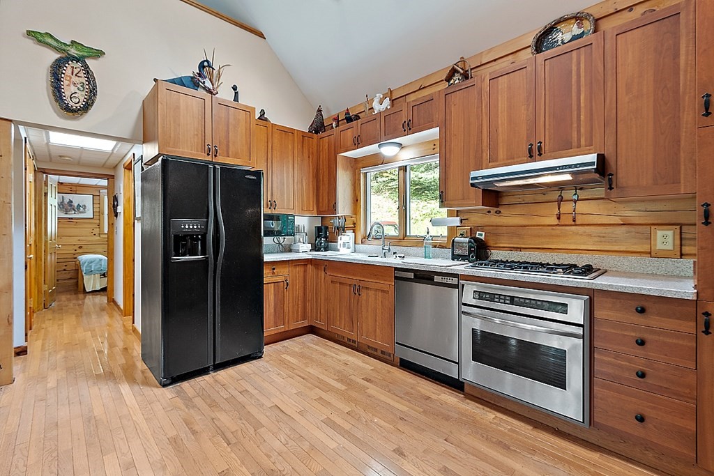 136 Wendell Road Warwick, MA 01378 - Photo 9 of 31 a kitchen with stainless steel appliances a stove a refrigerator and a microwave