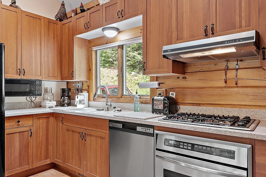 136 Wendell Road Warwick, MA 01378 - Photo 10 of 31 a kitchen with a stove a sink and a cabinets