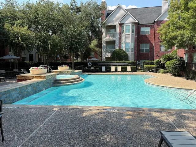 a front view of house with yard and outdoor seating