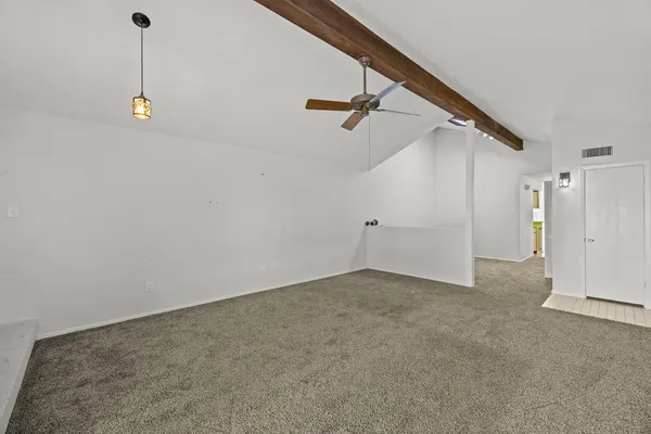 a view of a kitchen cabinets and a window