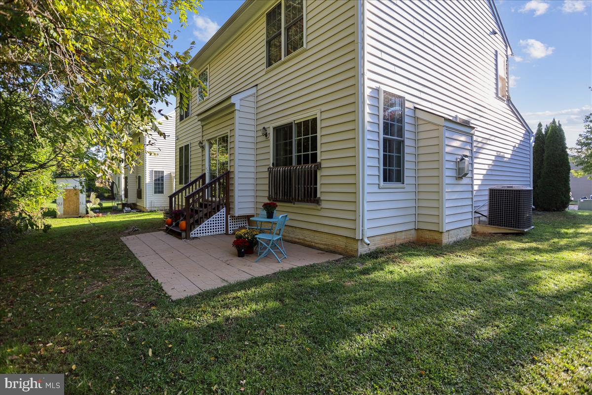 669 Hunters Road Culpeper, VA 22701 - Photo 4 of 30 Private backyard with a patio that backs to trees