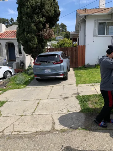 a car parked in front of a house