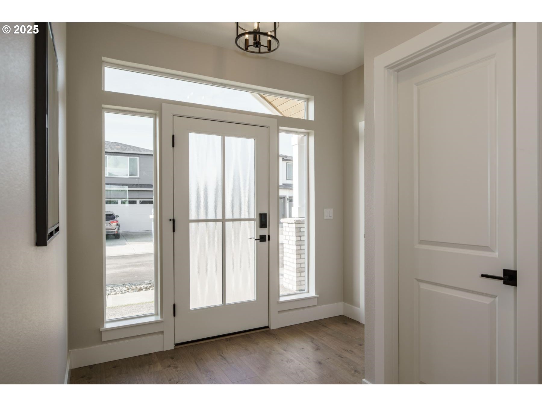 1126 South 46th Place Ridgefield, WA 98642 - Photo 17 of 43 a view of front door with wooden floor