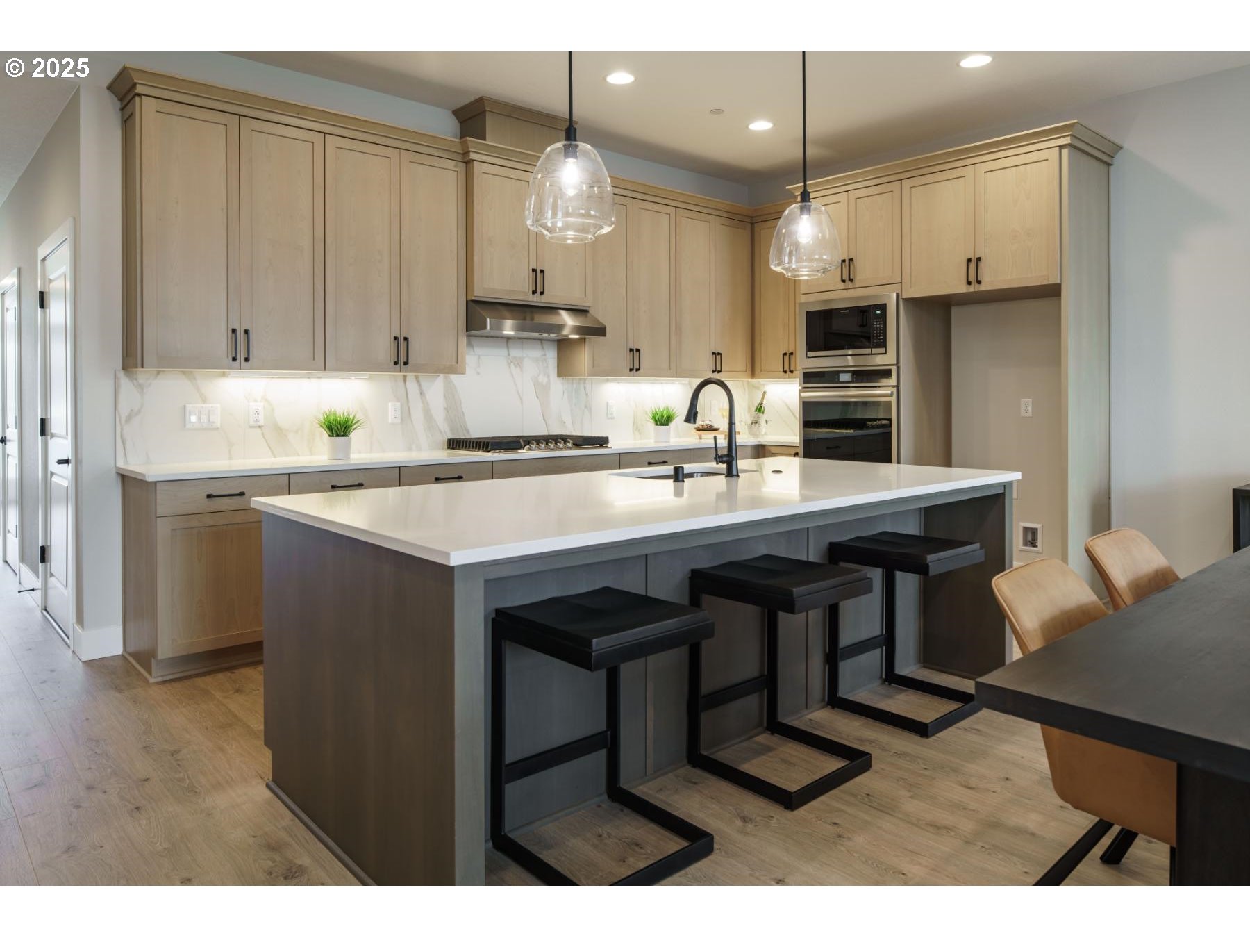 1126 South 46th Place Ridgefield, WA 98642 - Photo 21 of 43 a kitchen with kitchen island granite countertop a sink cabinets and stainless steel appliances