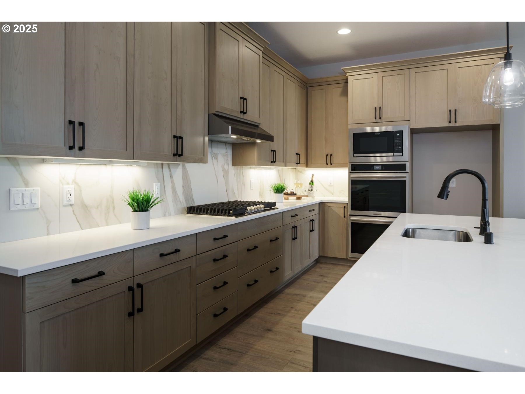 1126 South 46th Place Ridgefield, WA 98642 - Photo 23 of 43 a kitchen with stainless steel appliances a sink a stove a refrigerator cabinets and a window