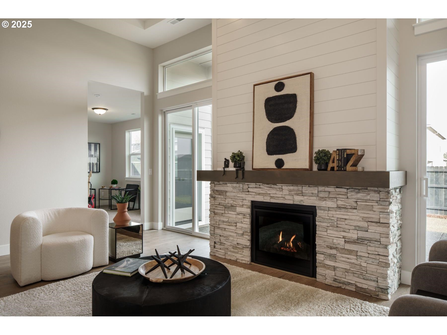 1126 South 46th Place Ridgefield, WA 98642 - Photo 26 of 43 a living room with furniture and a fireplace