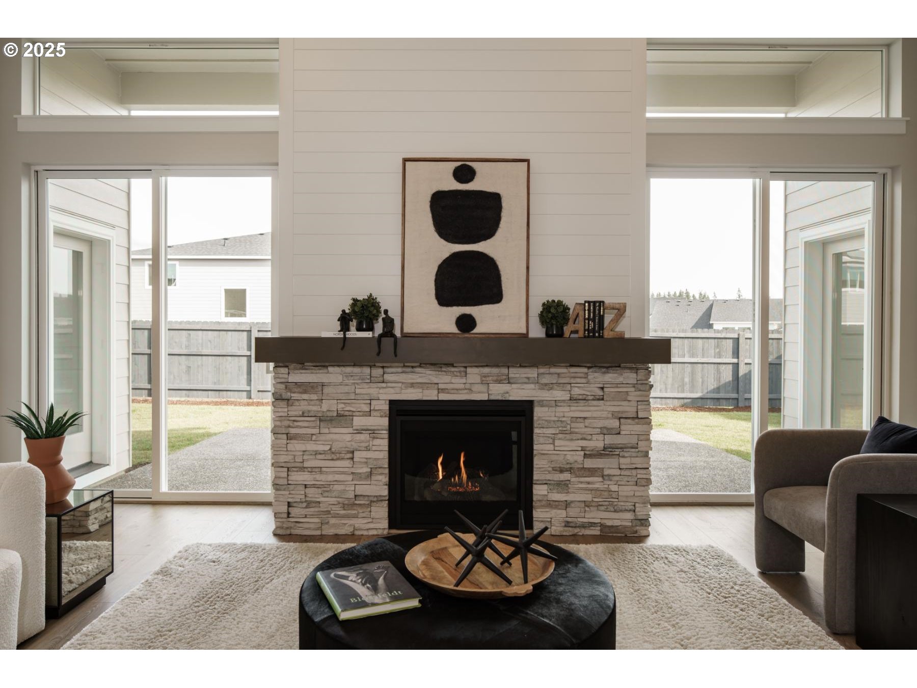 1126 South 46th Place Ridgefield, WA 98642 - Photo 28 of 43 a living room with furniture and a fireplace
