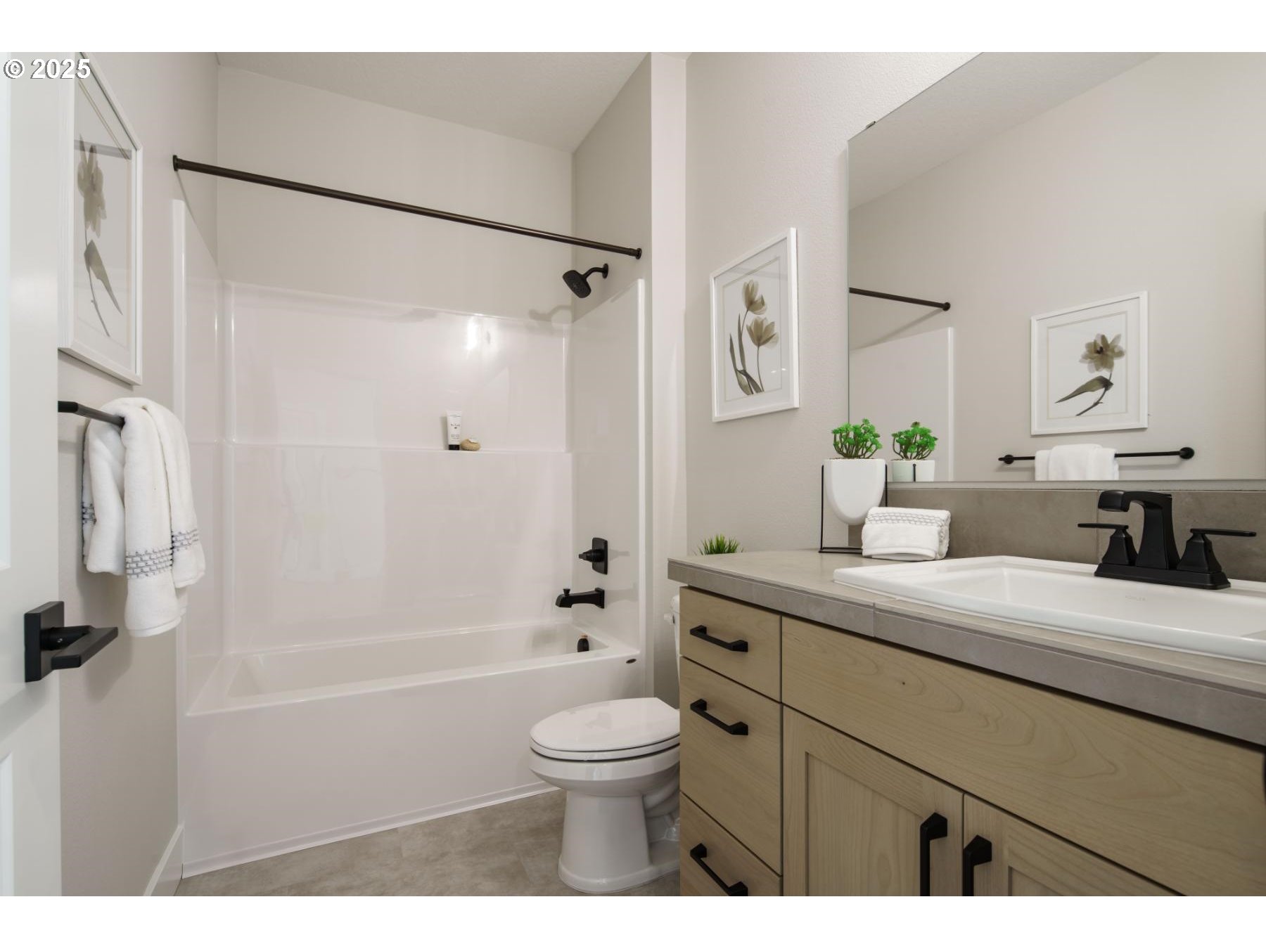 1126 South 46th Place Ridgefield, WA 98642 - Photo 35 of 43 a bathroom with a granite countertop sink a toilet a mirror and shower