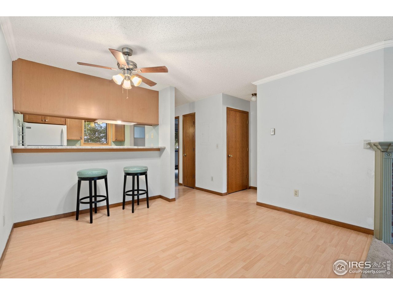 1213 West Swallow Road, Unit 213 Fort Collins, CO 80526 - Photo 11 of 24 a view of a livingroom with a furniture and chandelier fan