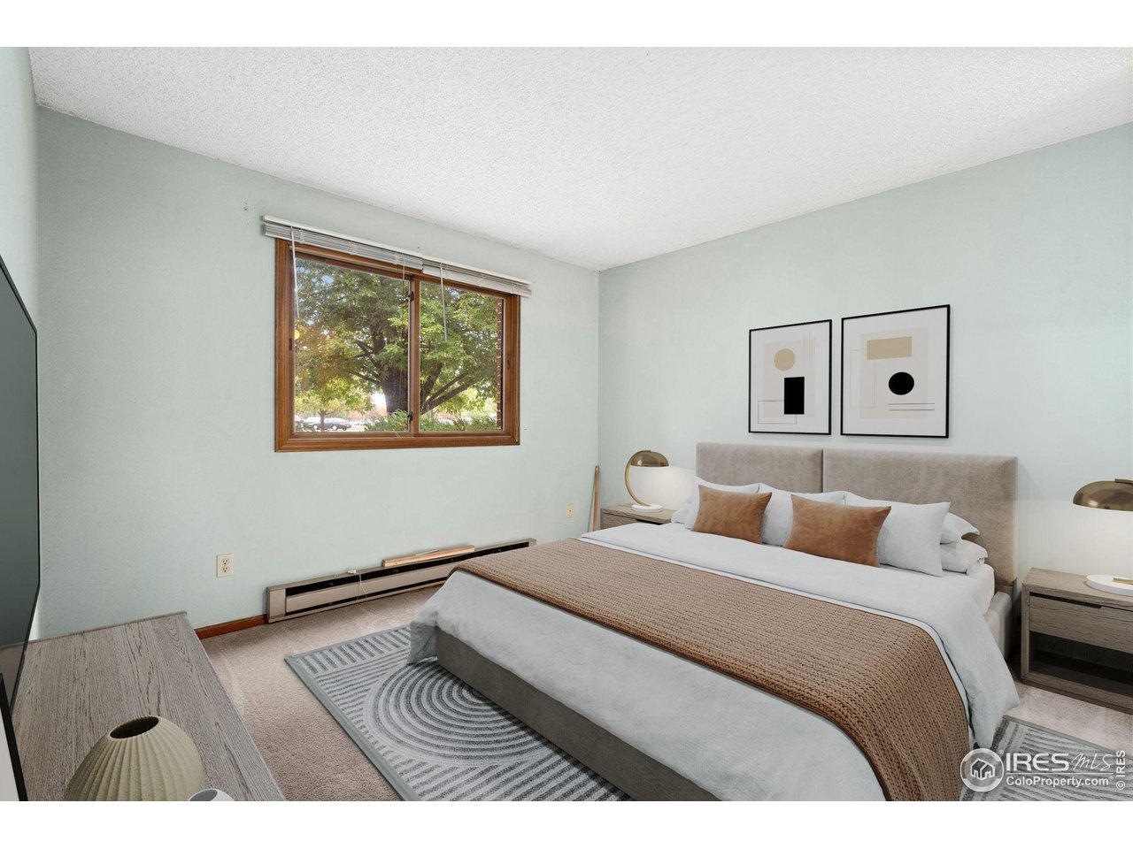 1213 West Swallow Road, Unit 213 Fort Collins, CO 80526 - Photo 17 of 24 a bedroom with a bed and a view of bathroom