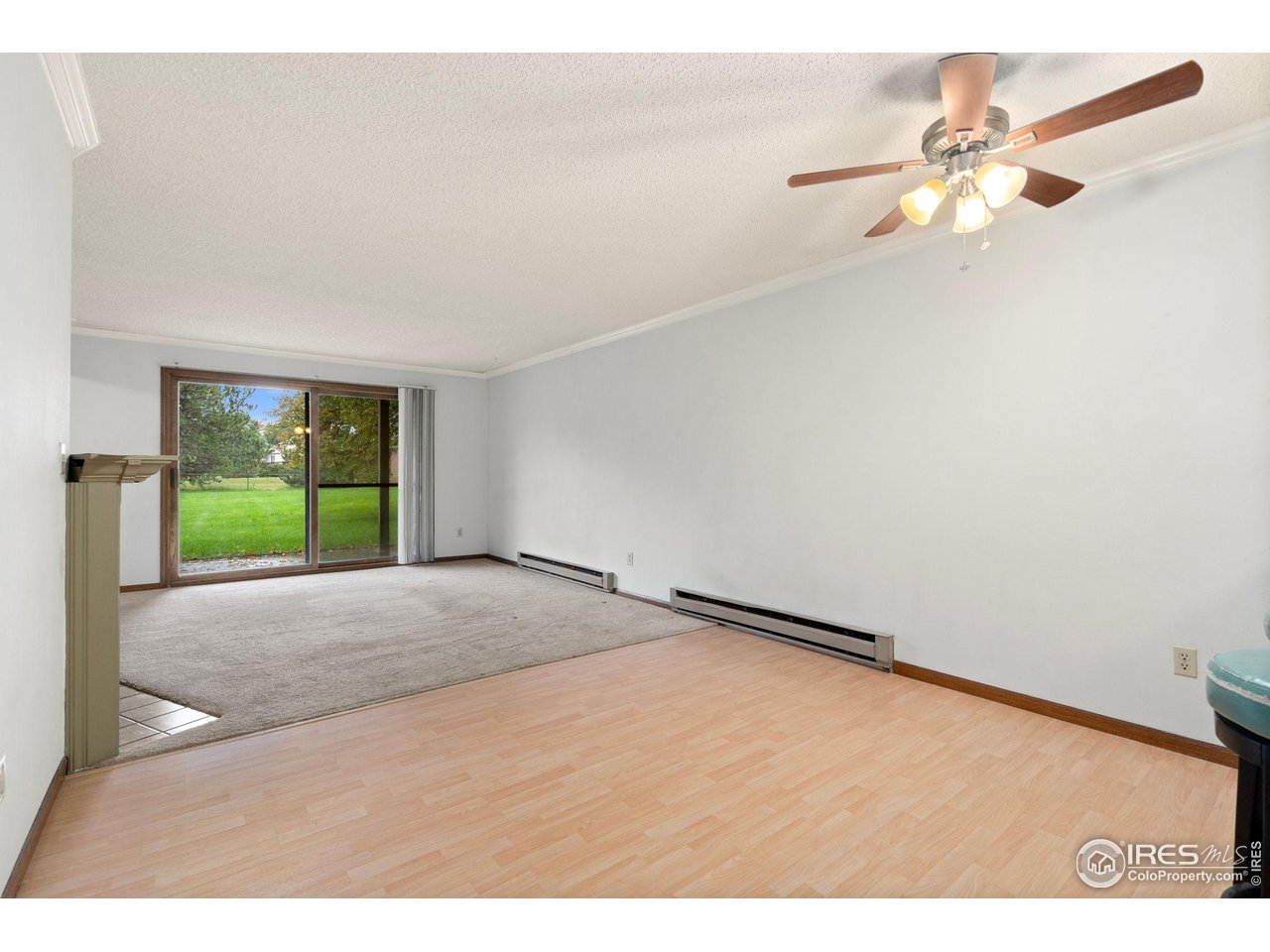 1213 West Swallow Road, Unit 213 Fort Collins, CO 80526 - Photo 7 of 24 a view of a room with a ceiling fan and window