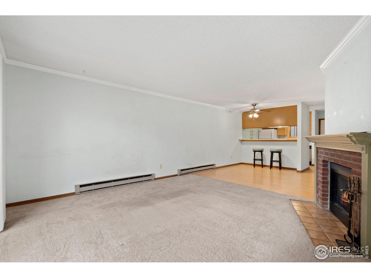 1213 West Swallow Road, Unit 213 Fort Collins, CO 80526 - Photo 8 of 24 a view of empty room with a fireplace