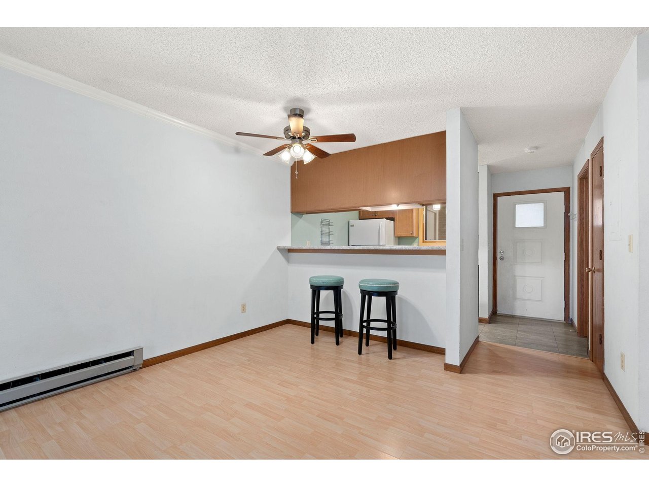 1213 West Swallow Road, Unit 213 Fort Collins, CO 80526 - Photo 9 of 24 a view of a room with a table and a chandelier
