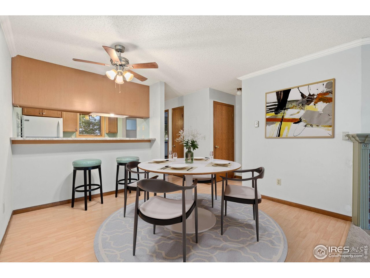 1213 West Swallow Road, Unit 213 Fort Collins, CO 80526 - Photo 10 of 24 a view of a dining room with furniture and a chandelier