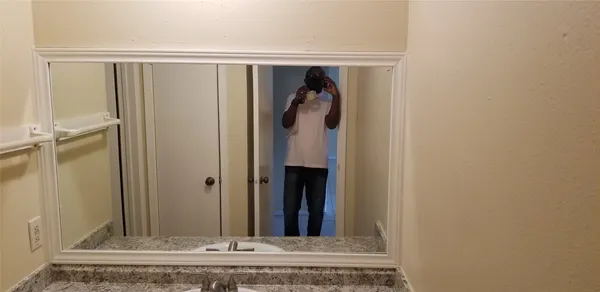 a kitchen with stainless steel appliances granite countertop a refrigerator and a stove