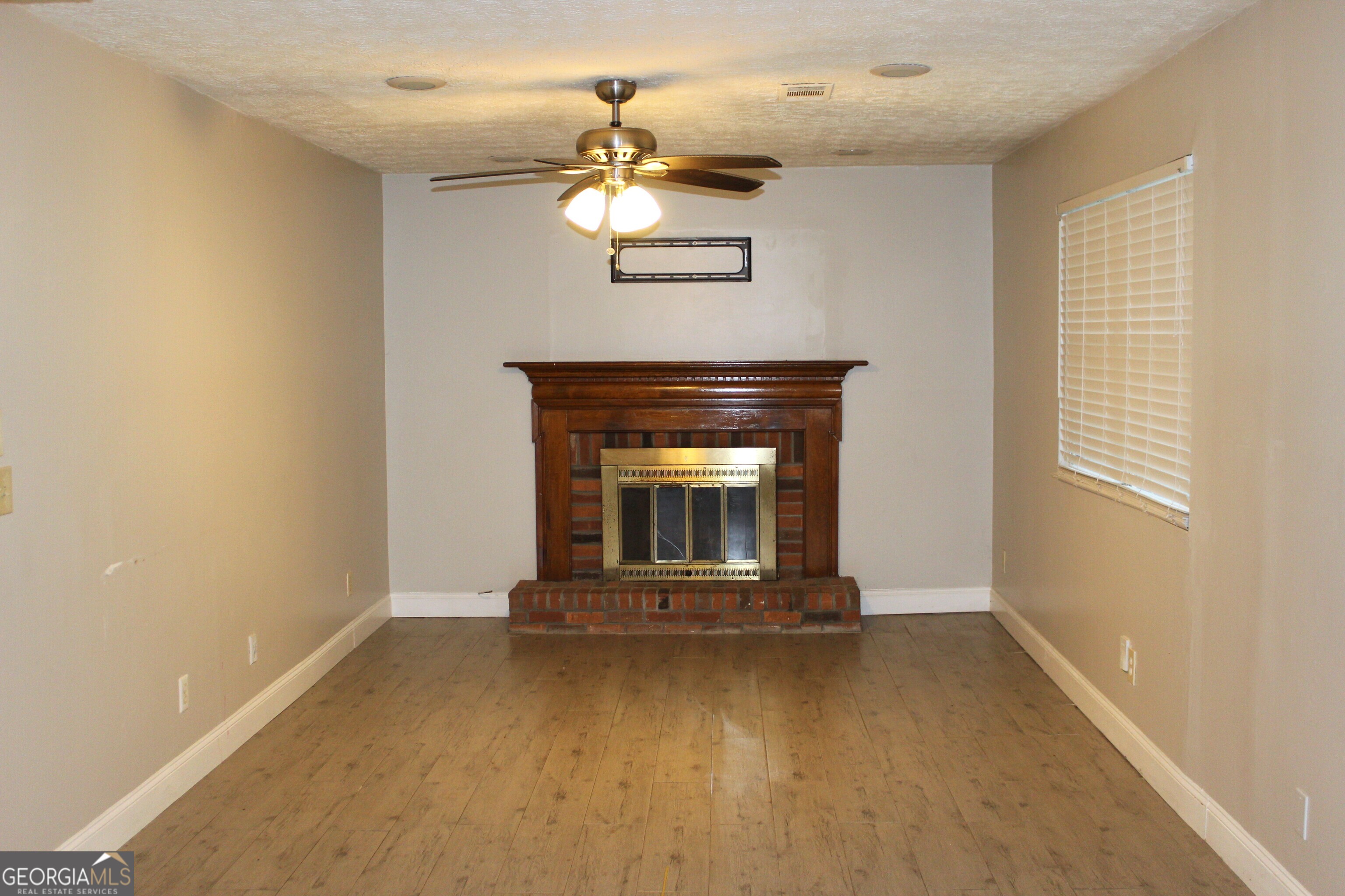 5811 Calico Court Lithonia, GA 30058 - Photo 8 of 14 a living room with a fireplace